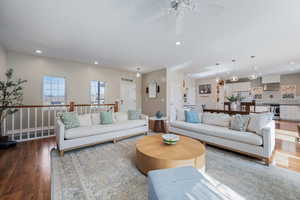 Living room featuring wood finished floors, recessed lighting, and a ceiling fan