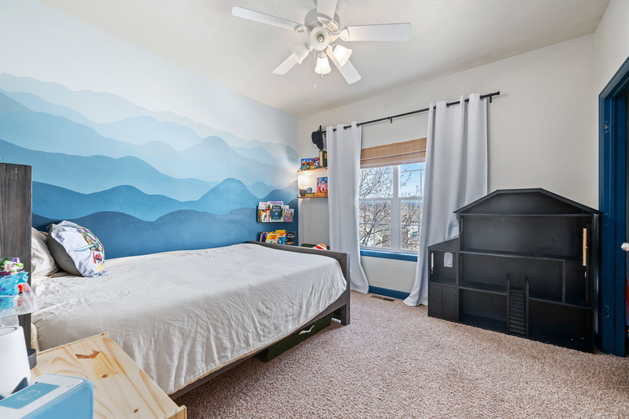 Bedroom with carpet flooring and a ceiling fan