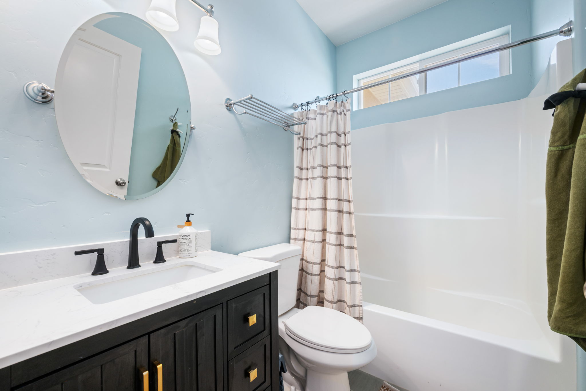 Full bath with vanity and shower / tub combo with curtain
