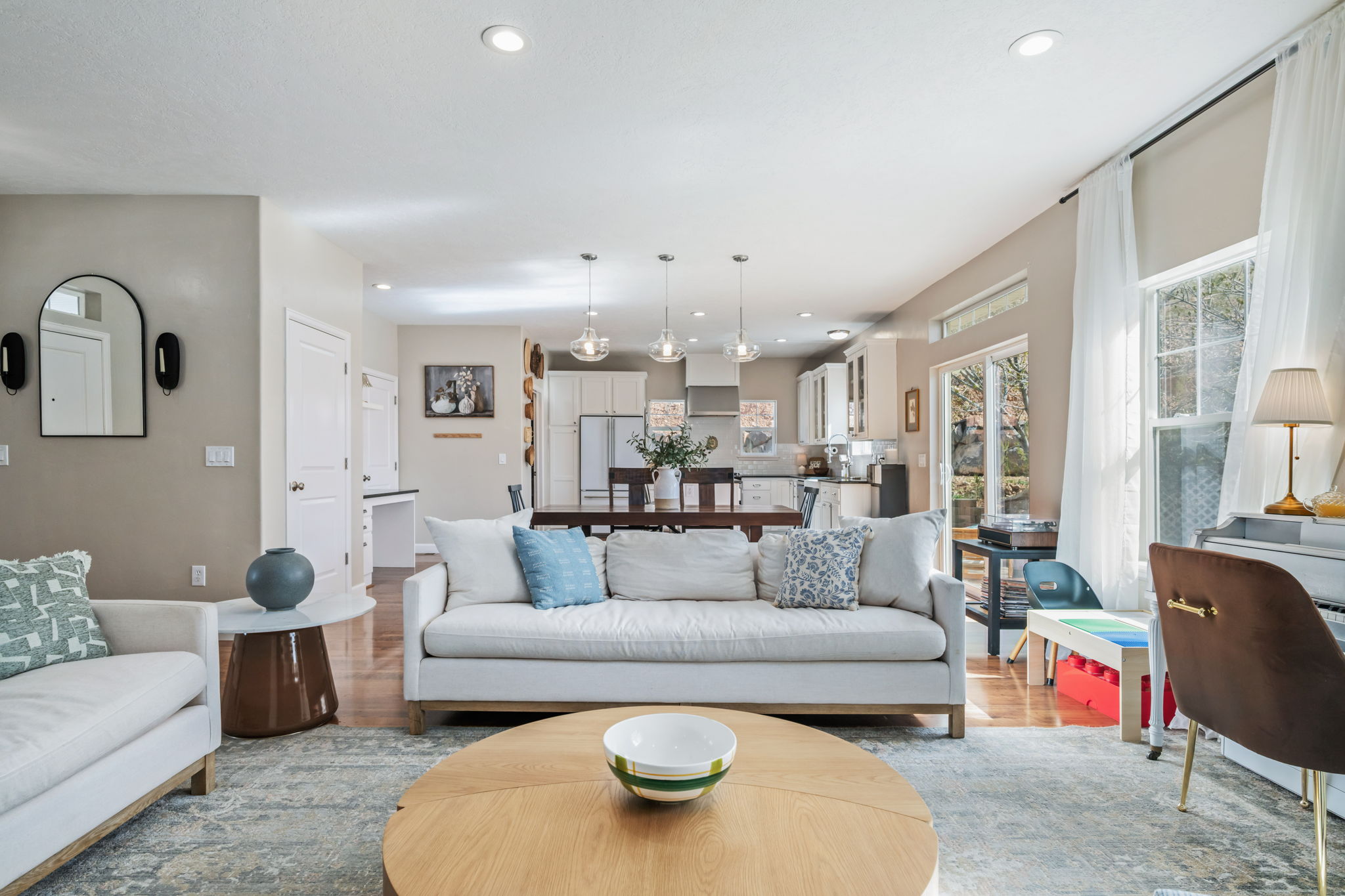 Living room with wood finished floors and recessed lighting
