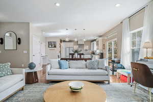 Living room with wood finished floors and recessed lighting