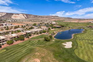 Aerial perspective of suburban area featuring a water and mountain view and a golf club