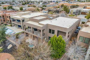 View of subject property with a pool area