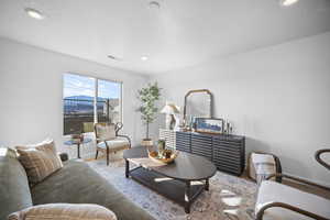 Living room featuring wood finished floors and recessed lighting