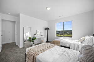 Carpeted bedroom with baseboards