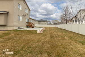 Fenced backyard with a patio and a residential view