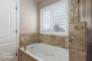 Master bathroom featuring a jetted tub