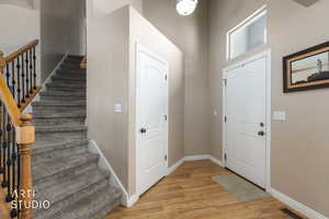Foyer entrance featuring  floors and a high ceiling