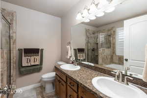 MasterBathroom with double vanity, a shower stall, and a bath