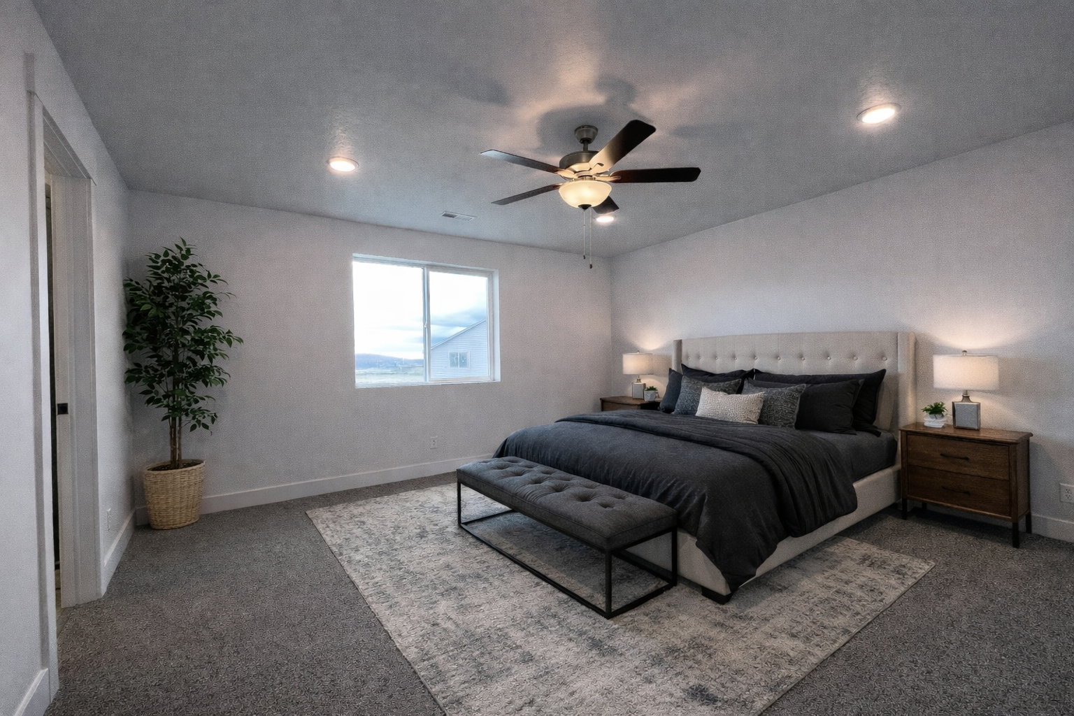 Primary bedroom featuring ceiling fan, recessed lighting, and carpet floors