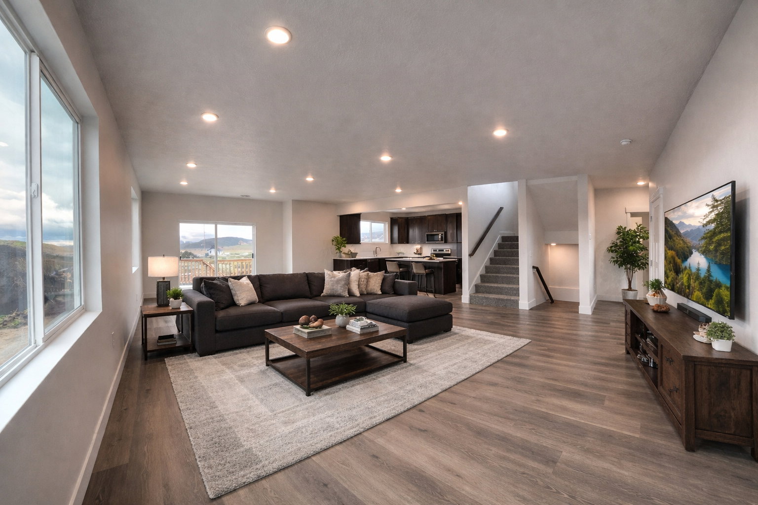 Living area with wood finished floors and recessed lighting