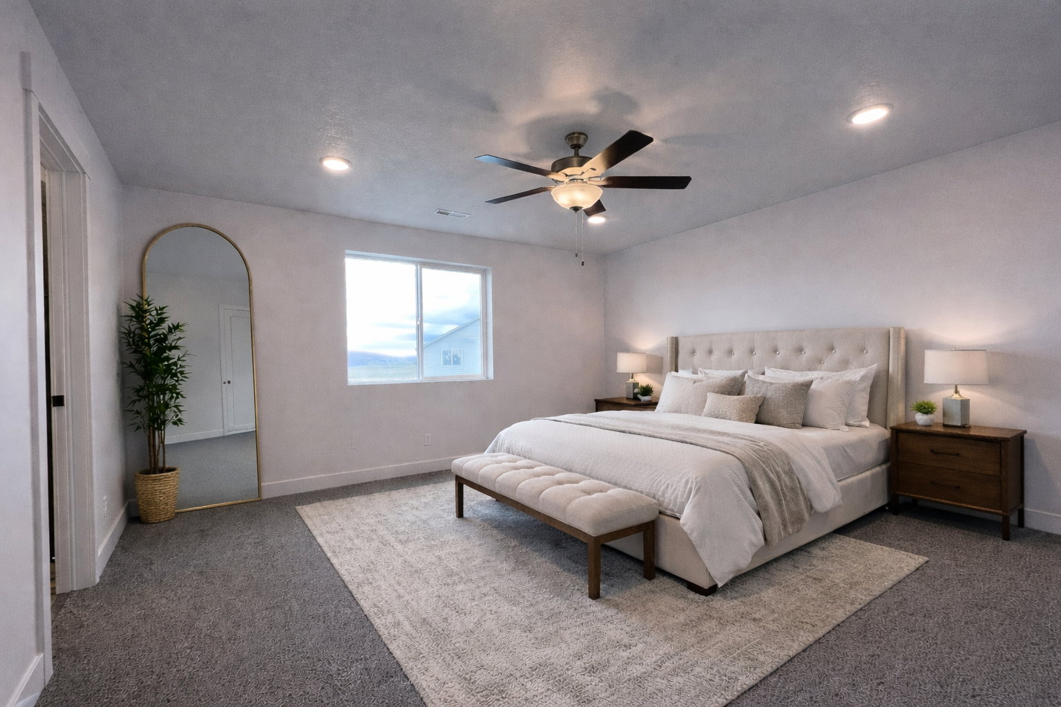 Primary bedroom featuring carpet floors, a ceiling fan, and recessed lighting
