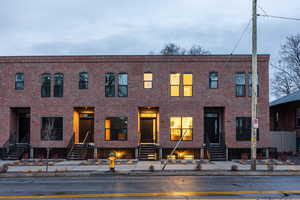 Traditional-style home featuring brick siding