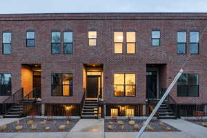 Traditional-style home with brick siding