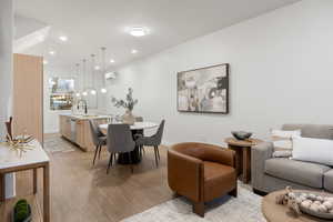 Dining space featuring light wood-type flooring and recessed lighting