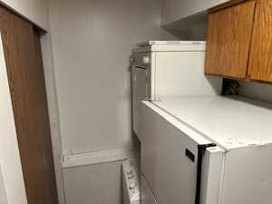 Laundry area with washer / dryer and cabinet space