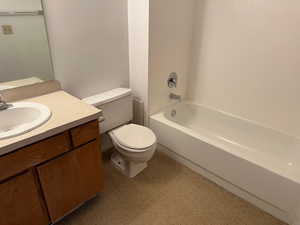 Bathroom with vanity and bathtub / shower combination