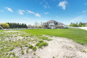 Back of property with a fenced backyard
