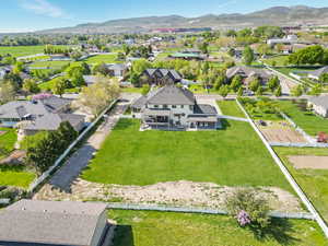 Aerial perspective of suburban area with a mountain backdrop