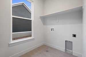 Laundry room featuring hookup for a washing machine and hookup for an electric dryer