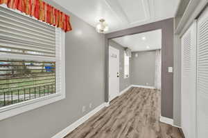 Entryway featuring light wood-style flooring and baseboards