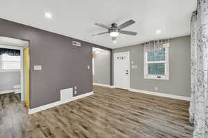 Foyer entrance featuring ceiling fan, wood finished floors, and recessed lighting