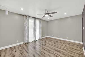 Empty room with light wood finished floors, recessed lighting, and ceiling fan