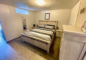 Bedroom featuring dark wood-style flooring