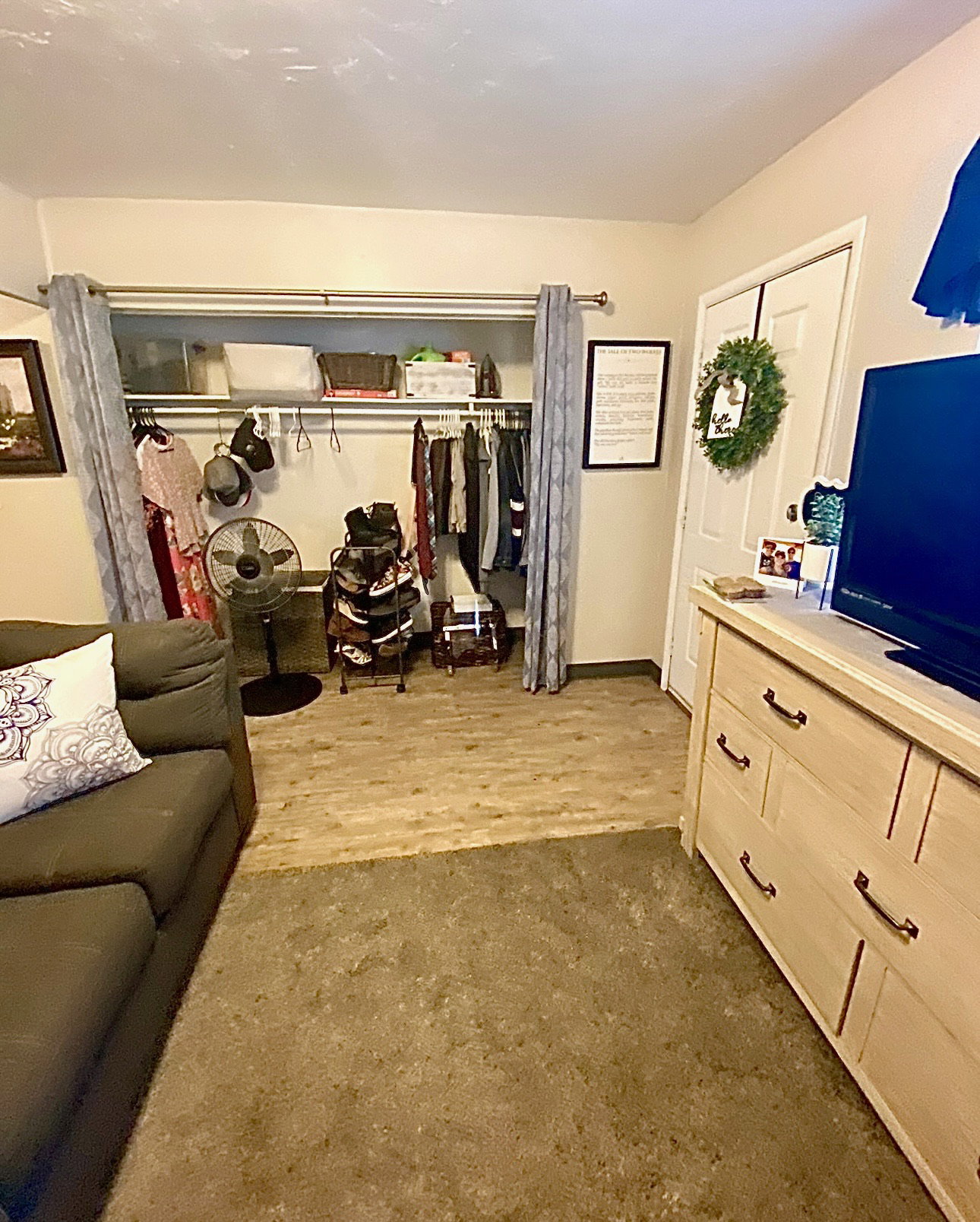 Bedroom featuring a closet and dark wood-style flooring