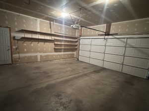 Garage featuring a garage door opener