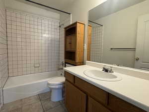 Full bathroom with vanity, tub / shower combination, and light tile patterned floors