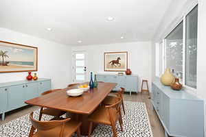 Dining space featuring light wood-type flooring and recessed lighting