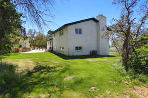 White brick exterior with a dark trim roofline