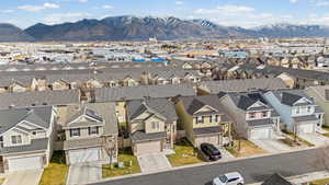 Aerial view of residential area featuring a mountain backdrop