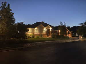 View of front of property featuring board and batten siding and a front lawn