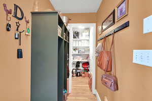 Hallway featuring light wood-style floors