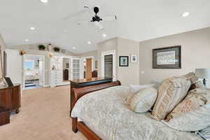 Bedroom featuring a walk in closet, a ceiling fan, light carpet, and recessed lighting