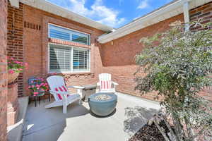 View of patio with an outdoor fire pit