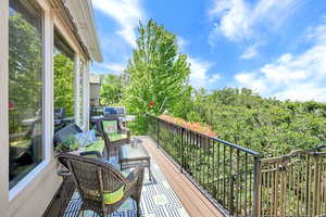 Balcony featuring area for grilling