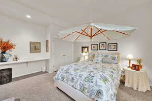 Bedroom with carpet floors and baseboards