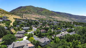 Aerial view of residential area with a mountainous background