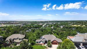 Aerial view of residential area featuring a mountain backdrop