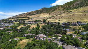 Aerial view of residential area featuring a mountainous background