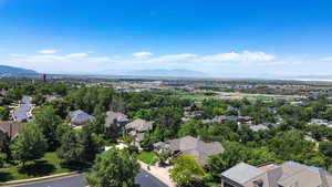 Aerial perspective of suburban area with a mountainous background