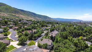 Aerial perspective of suburban area featuring a mountainous background
