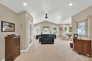 Playroom with healthy amount of natural light, light carpet, ceiling fan, recessed lighting, and a textured ceiling