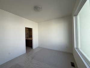 Spare room with carpet and plenty of natural light