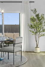 Dining space with wood finished floors and baseboards