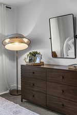 Detailed view of carpet and baseboards