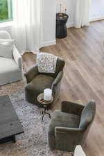 Sitting room with healthy amount of natural light and light wood-type flooring